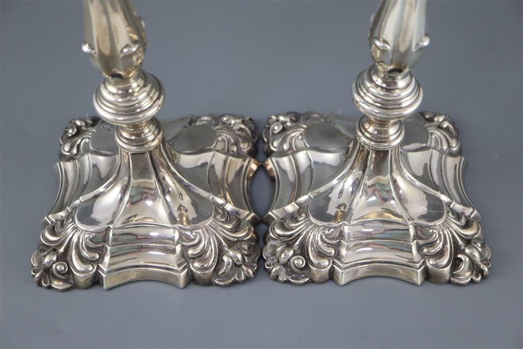 A pair of Edwardian silver candlesticks by William Hutton & Sons,